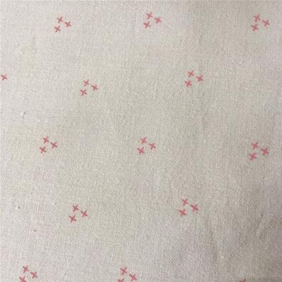 Coral stitches on pale pink fabric