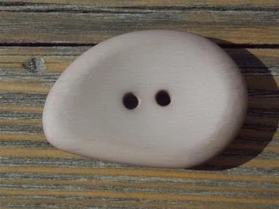 Large button in a tear shape